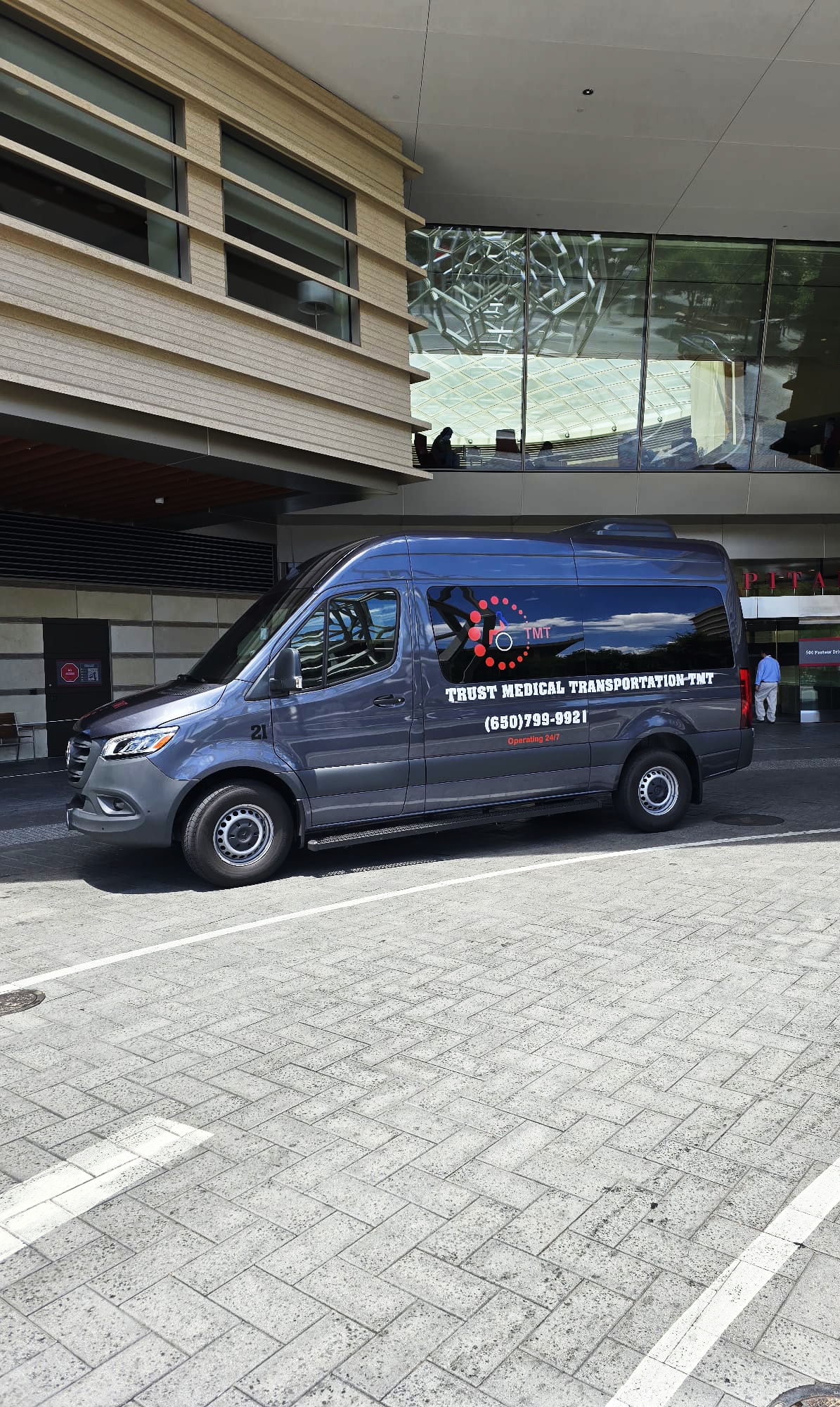 Trust Medical Transportation medical van and hospital building